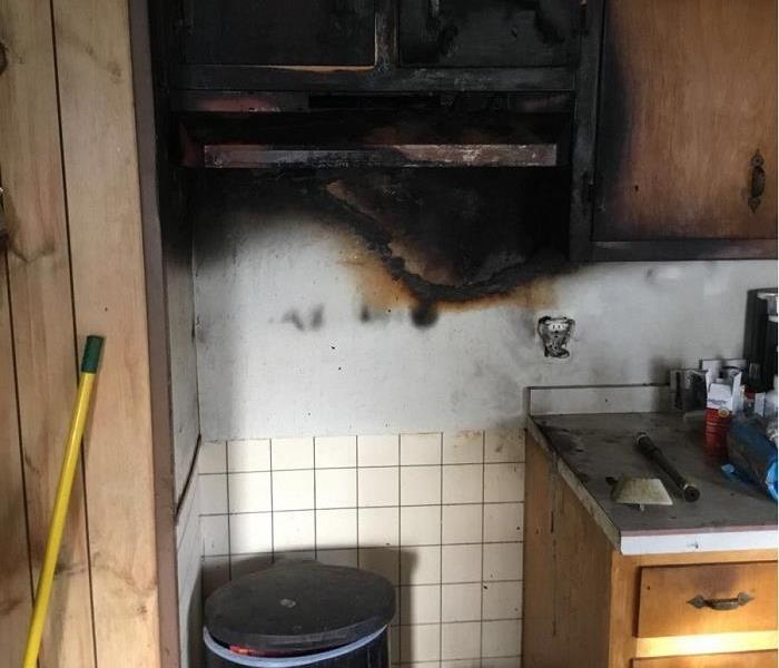 Photo of kitchen cabinets damaged by fire